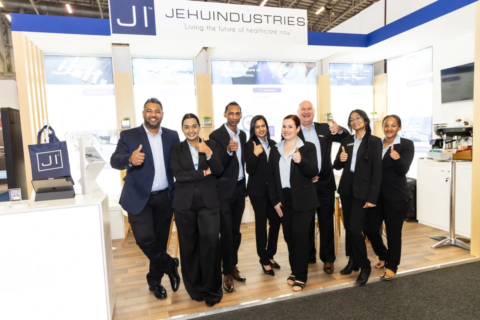 The Jehu Industries event team posing together inside the completed Africa Health stand.