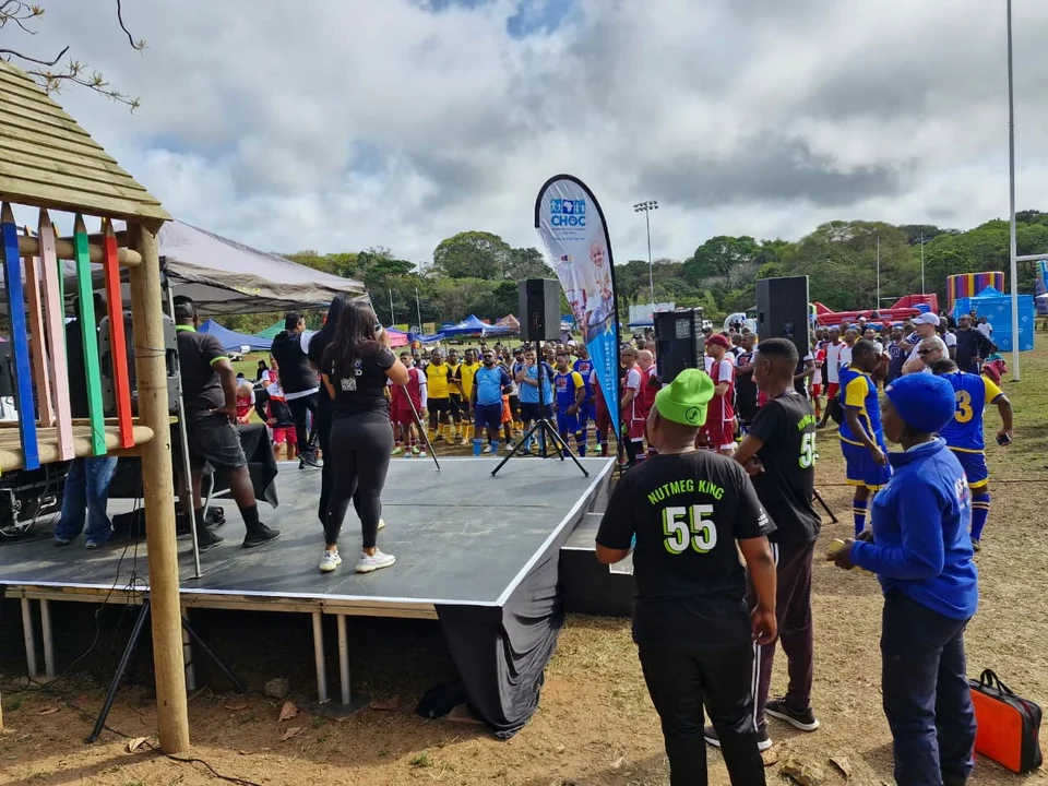 Hospital teams gathered around the stage at Kick for a Kid 2024.