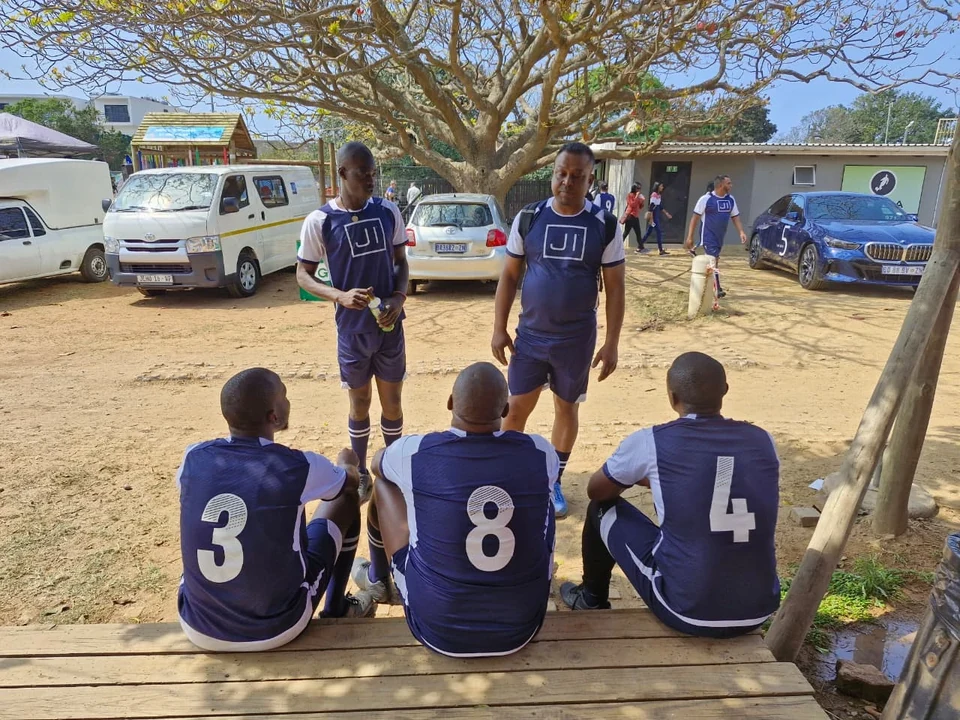The Jehu team gathered between matches in coordinated branded football kits.