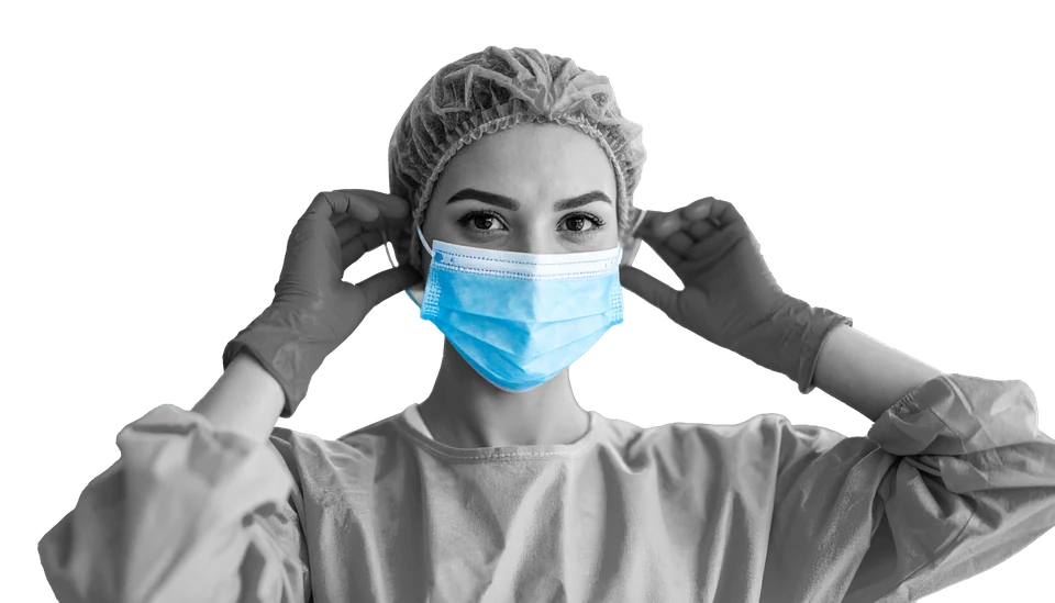 Monochrome clinician adjusting a blue earloop mask