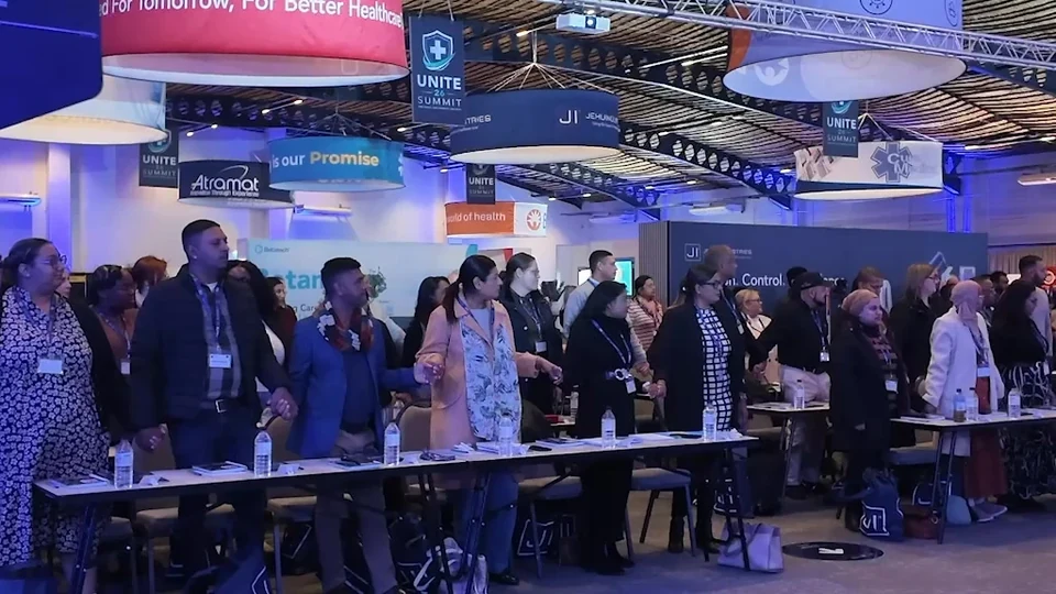 UNITE delegates gathered among the completed branded exhibition stands.
